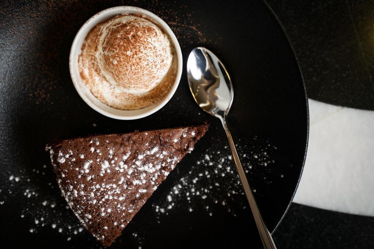 Ambiance Boutique Art Hotel לאהור מראה חיצוני תמונה A chocolate cake with a cup of coffee